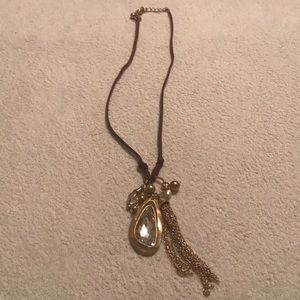 Adjustable necklace on leather strap.